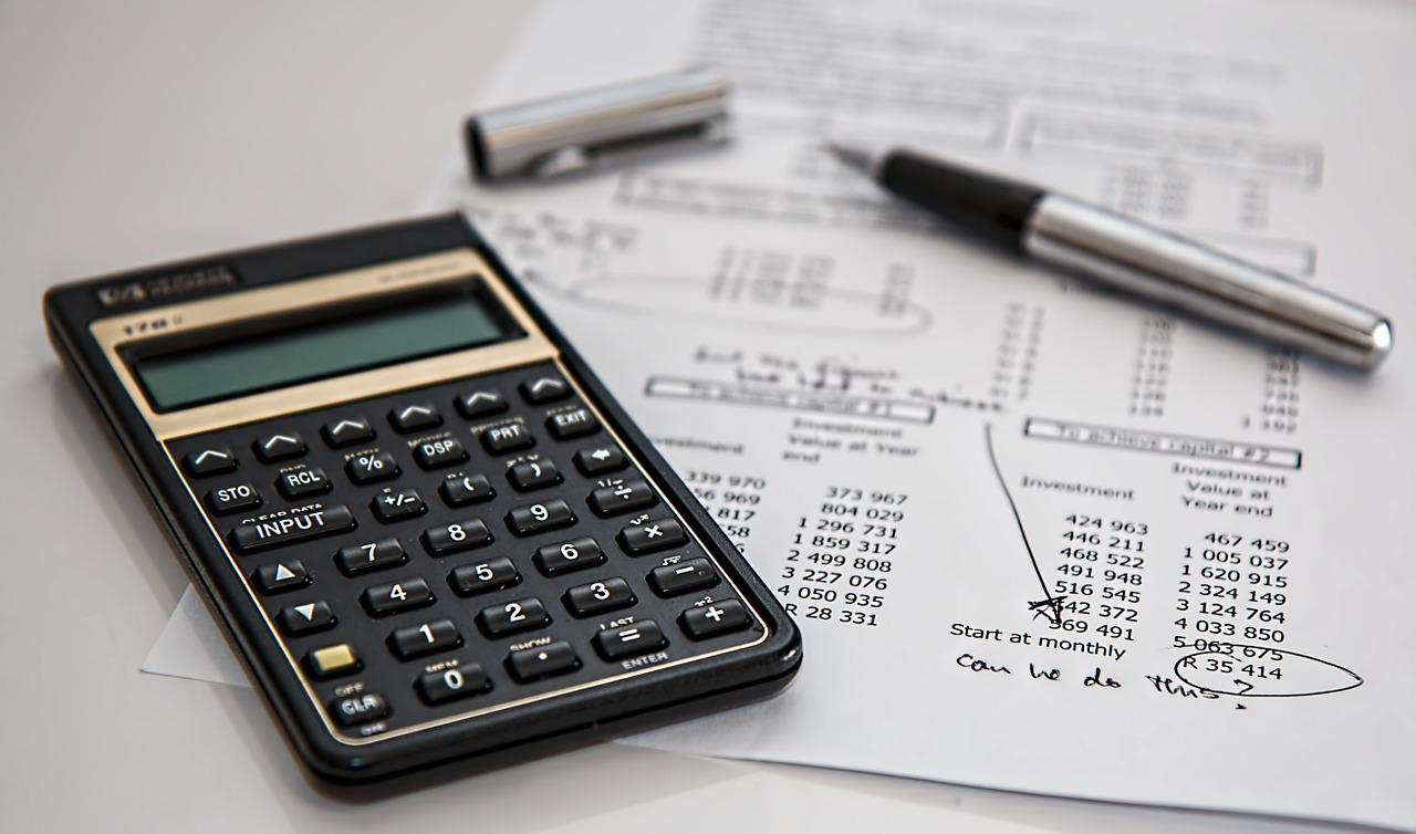 Financial Calculator With Financial State and Pen in the Background